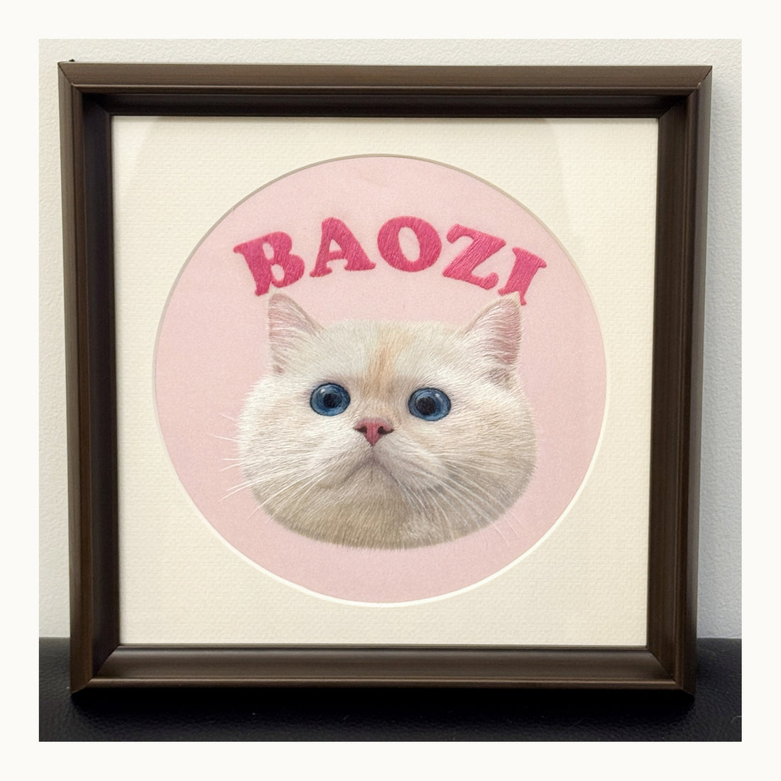 Finished custom cat portrait of Mimi in warm-white presentation