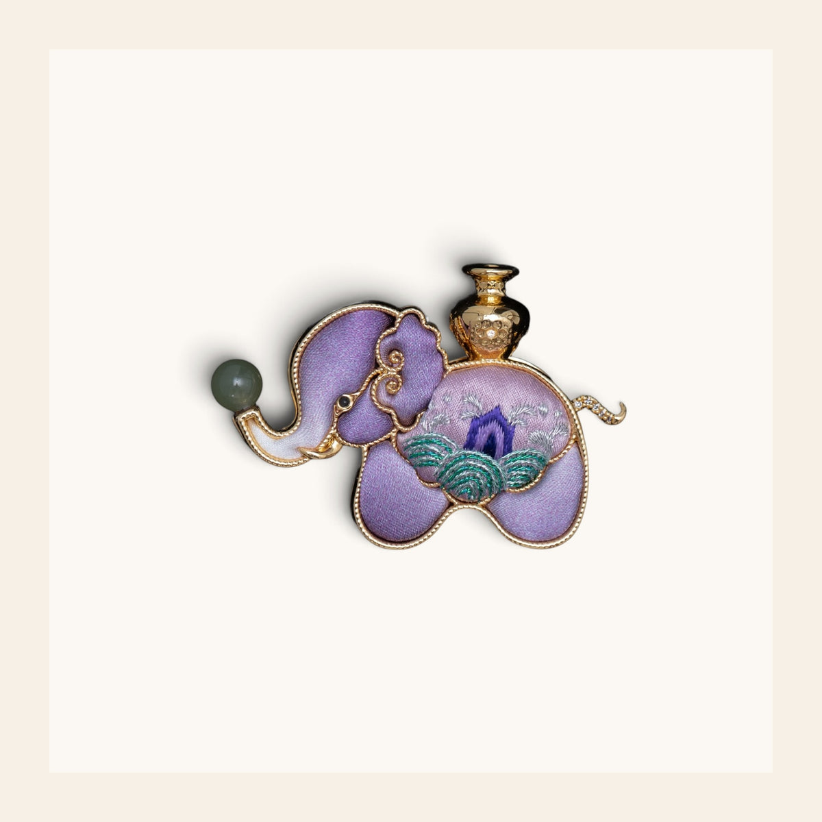 Front view of purple elephant Su-embroidery brooch