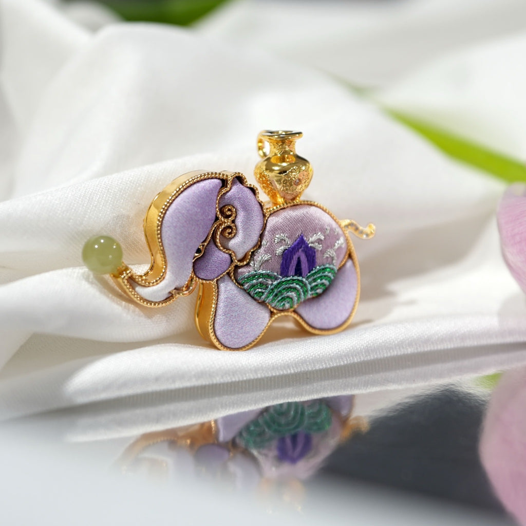 Front view of purple elephant Su-embroidery brooch