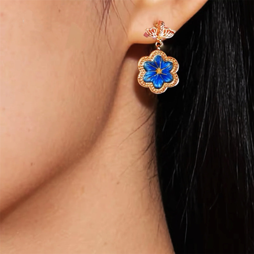 Front view of blue daisy Su-embroidery stud-drop earrings