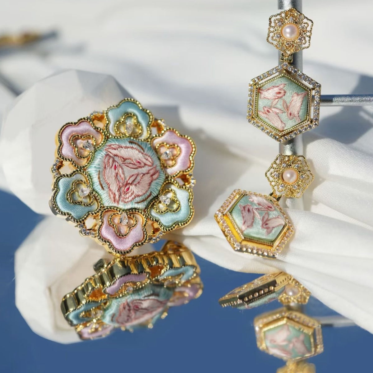 Front view of pink hexagonal hibiscus Su-embroidery dangle earrings