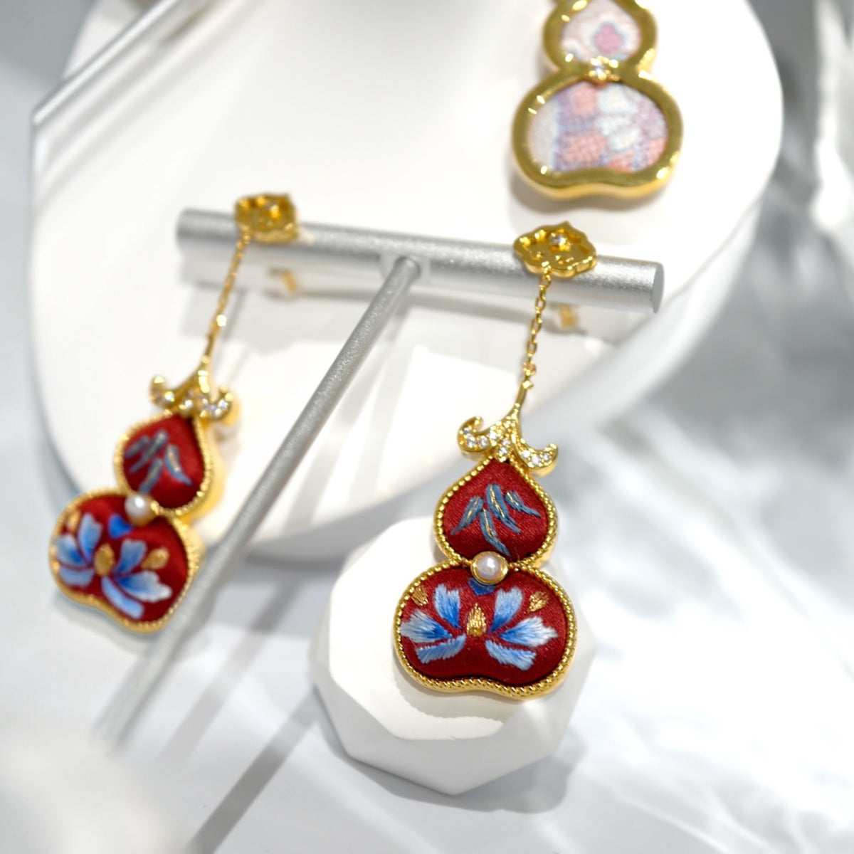 Front view of red hulu gourd Su-embroidery dangle earrings