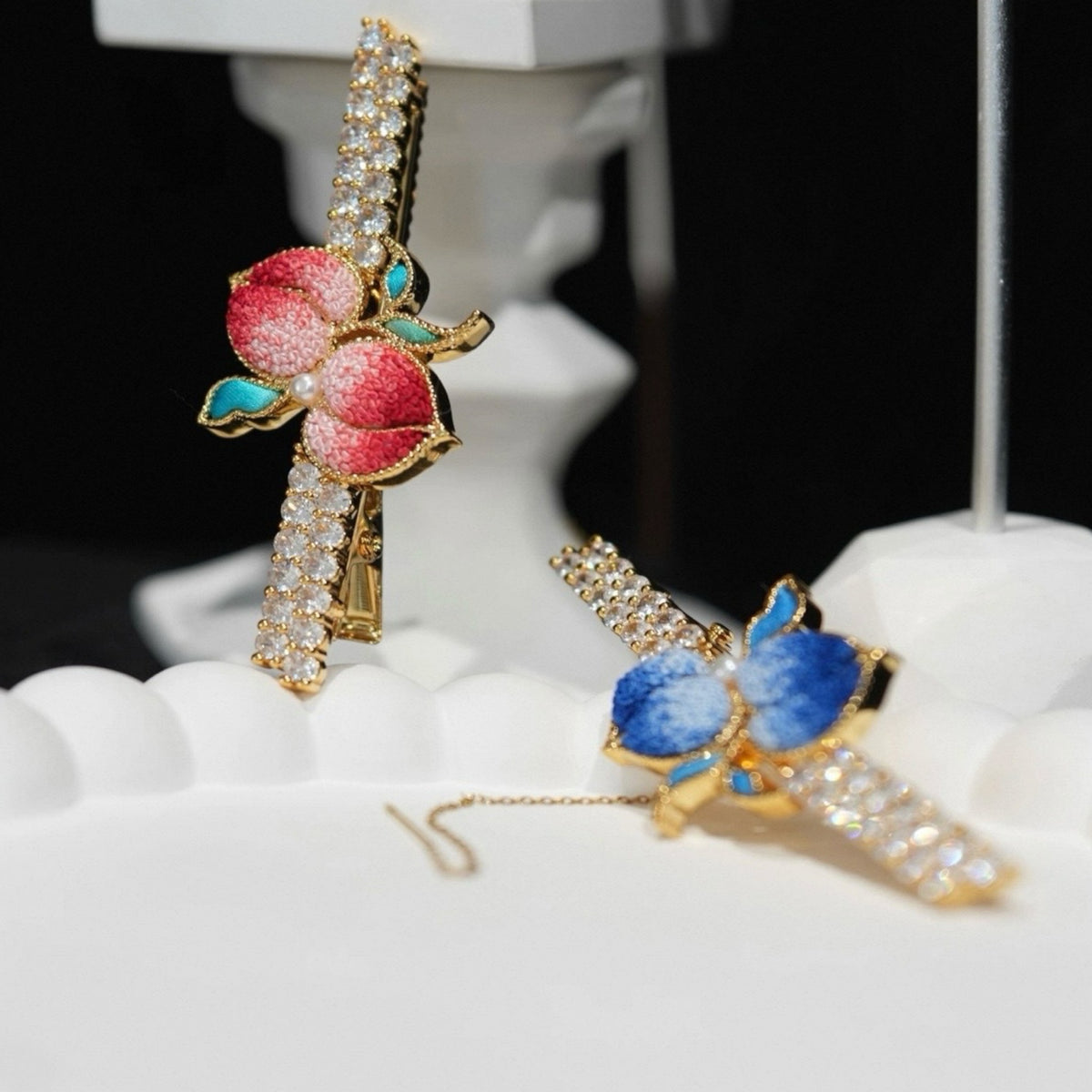 Front view of blue peach Su-embroidery hair accessory