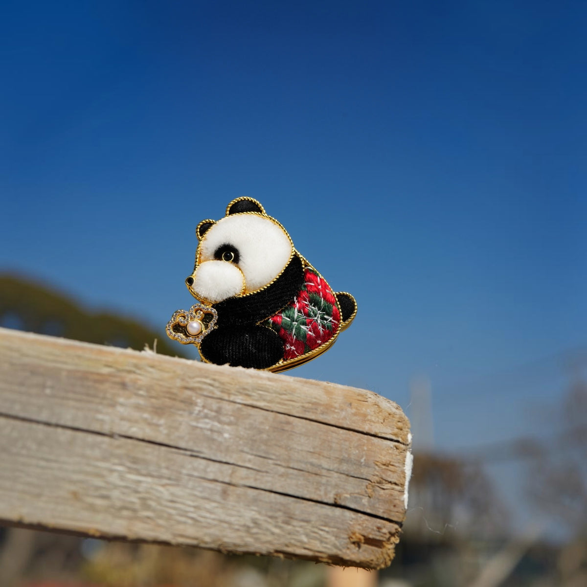Front view of red panda ruyi Su-embroidery pendant